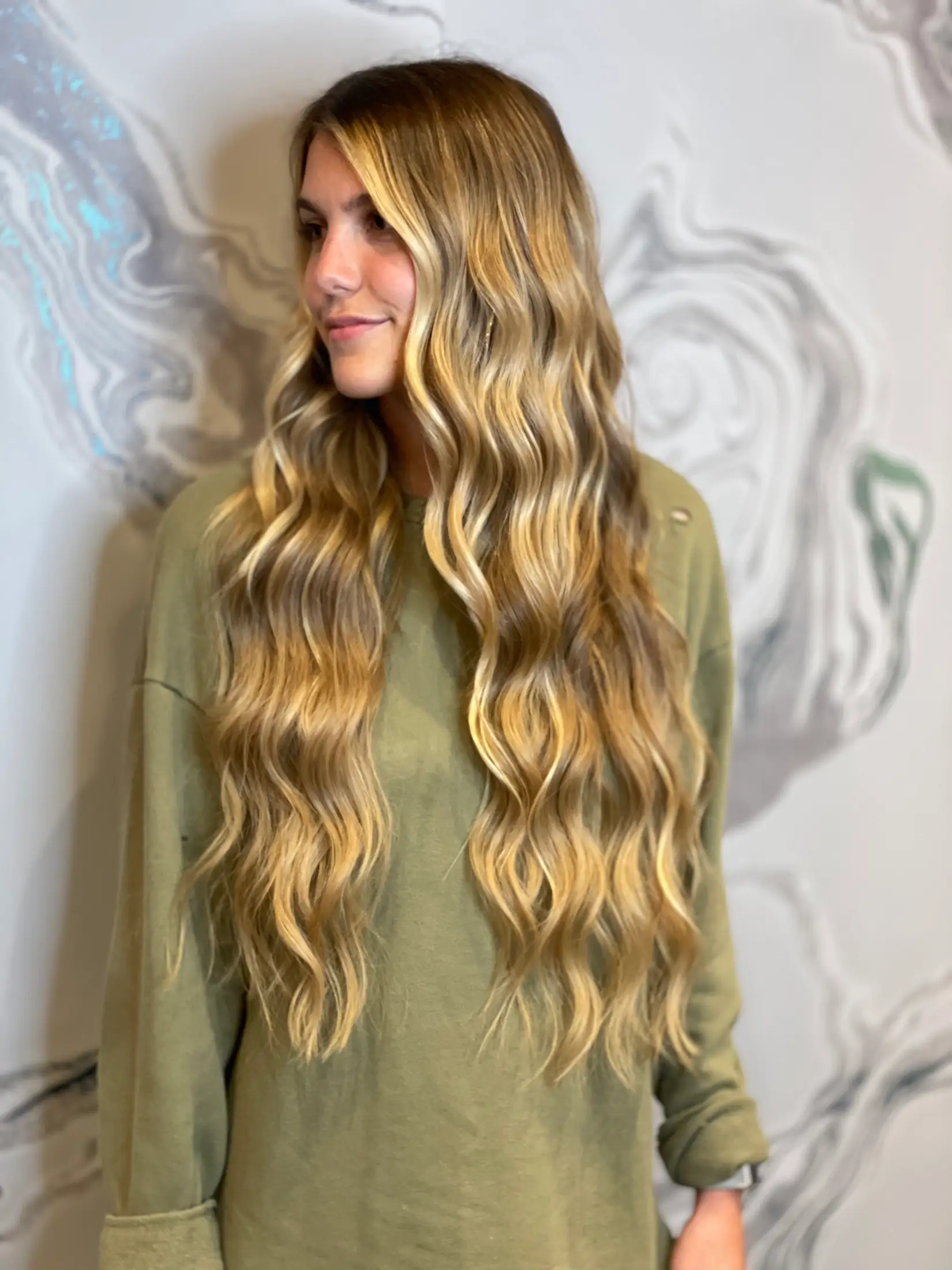 Blonde hair extensions worn long and loose